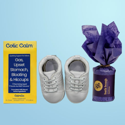 A curated collection for baby's comfort and style, showcasing Colic Calm, a relaxing Bedtime Bath Bomb, and fashionable white Carnaby Baby Sneakers.