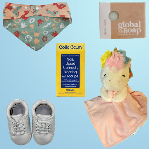 Image of a baby gift set featuring Colic Calm supplement, a pink unicorn cuddle blanket, white infant sneakers, and a Global Soap baby soap bar, creating an ideal baby care package.