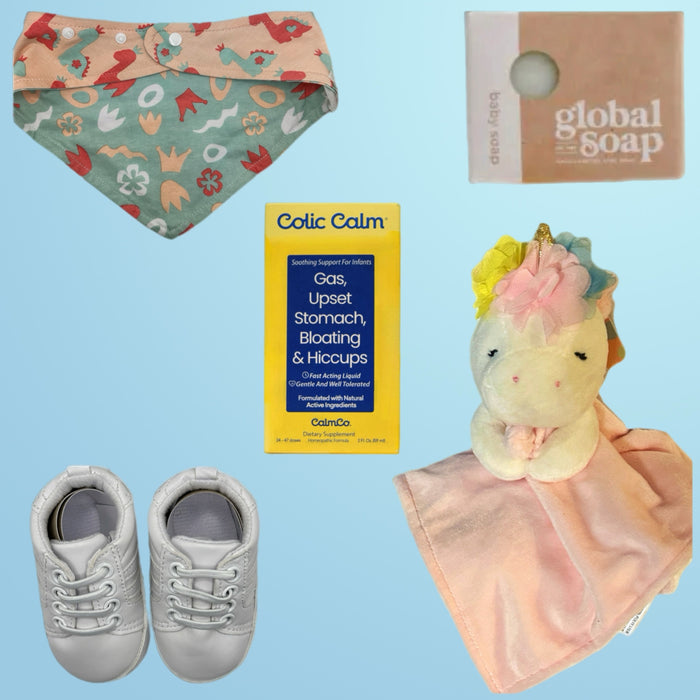 Image of a baby gift set featuring Colic Calm supplement, a pink unicorn cuddle blanket, white infant sneakers, and a Global Soap baby soap bar, creating an ideal baby care package.